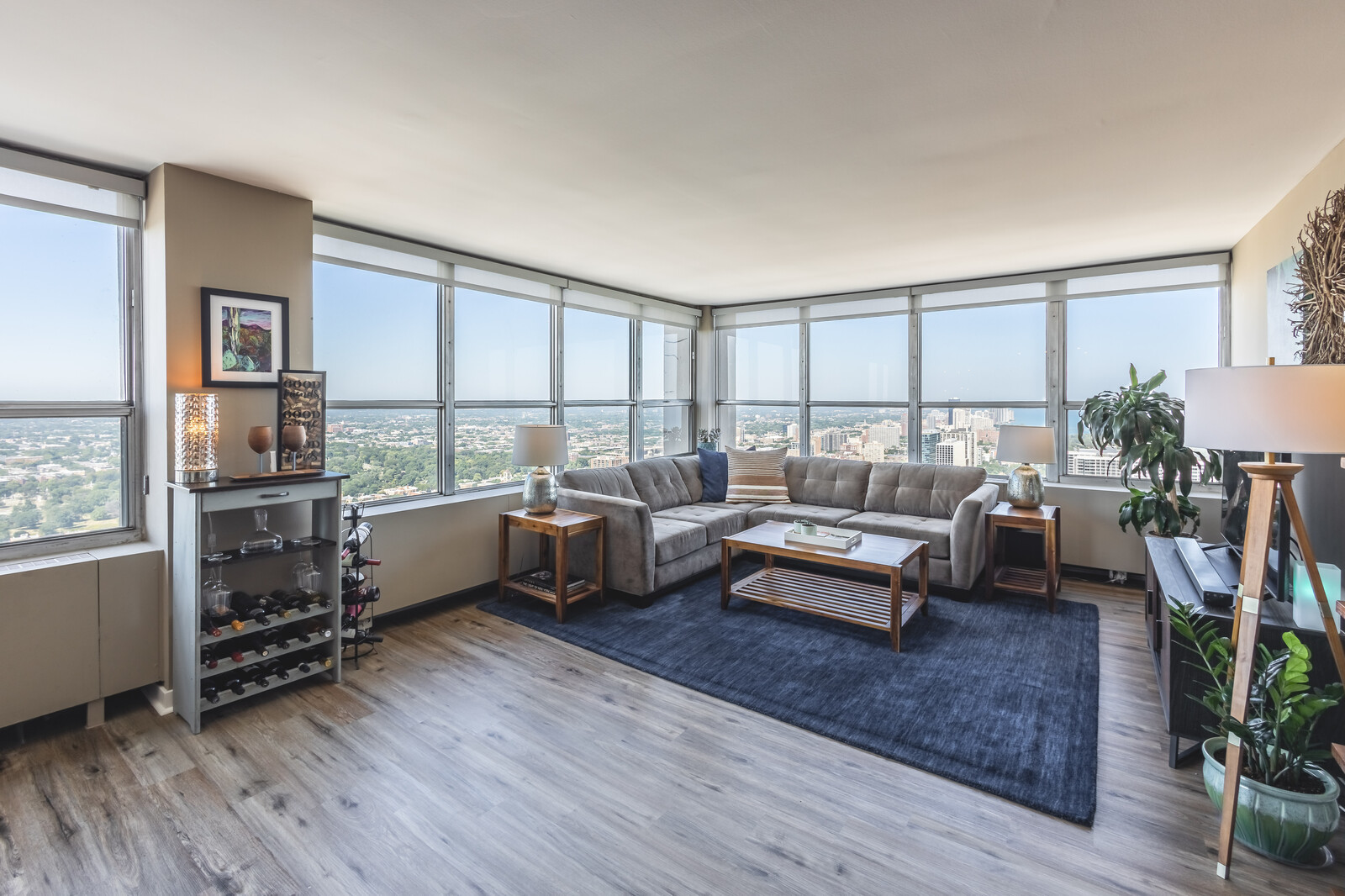 655 West Irving Park Road, Unit 4616 Chicago, IL 60613 - Photo 2 of 25 a living room with furniture and a wooden floor