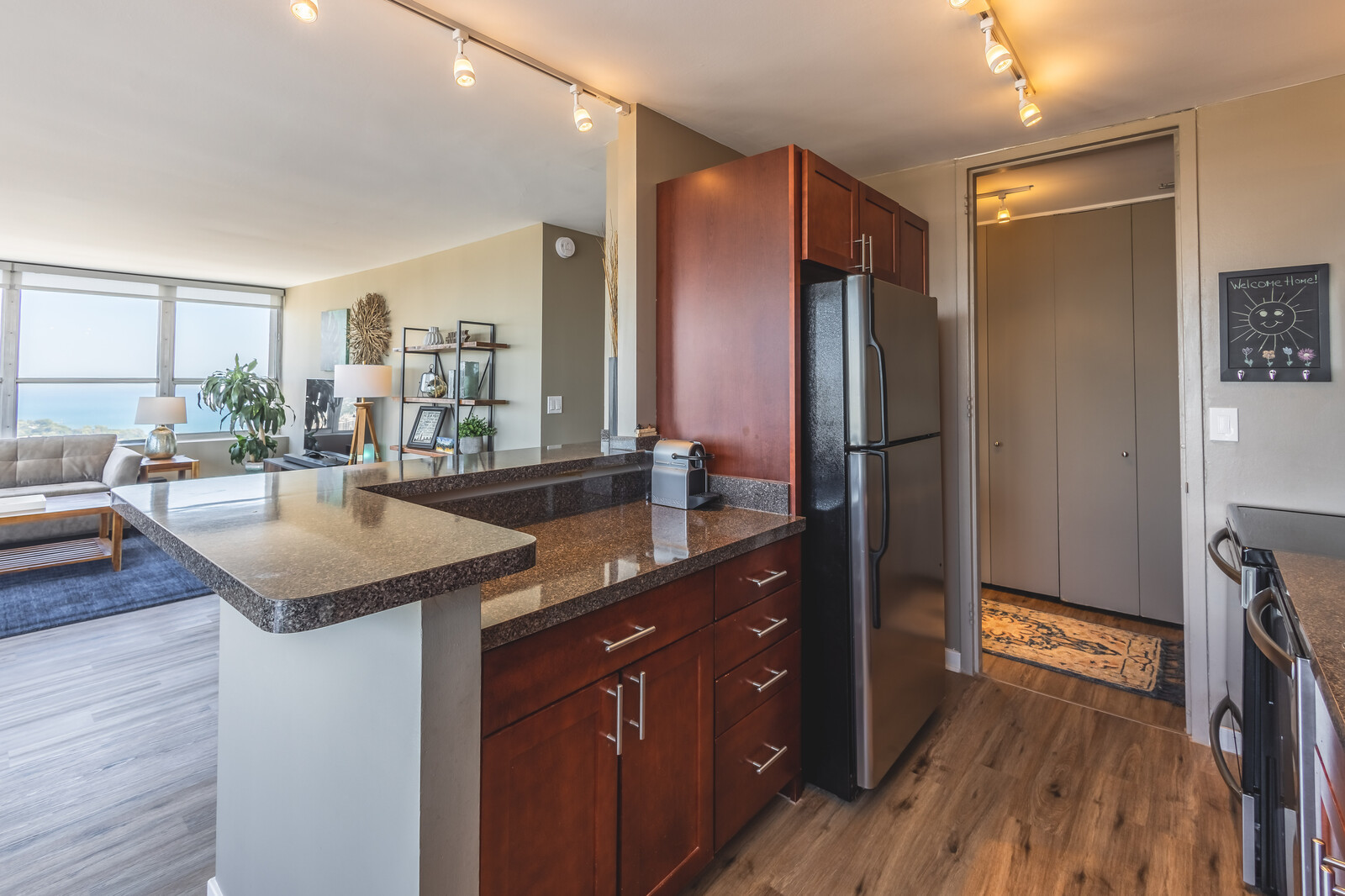 655 West Irving Park Road, Unit 4616 Chicago, IL 60613 - Photo 5 of 25 a kitchen with stainless steel appliances granite countertop a sink stove and refrigerator