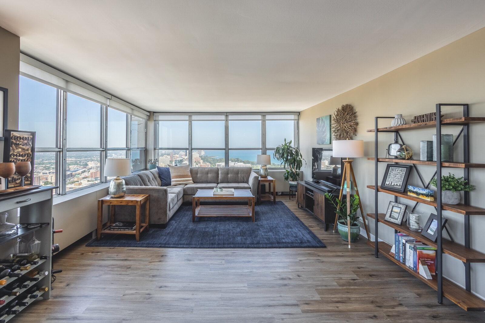 655 West Irving Park Road, Unit 4616 Chicago, IL 60613 - Photo 8 of 25 a living room with furniture and a wooden floor