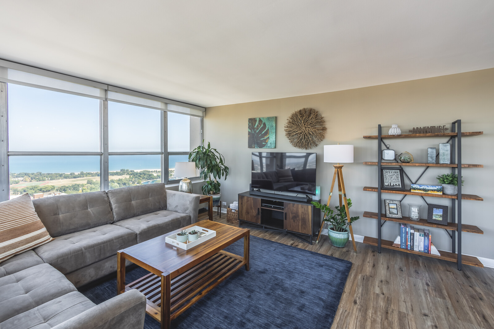 655 West Irving Park Road, Unit 4616 Chicago, IL 60613 - Photo 9 of 25 a living room with furniture and a wooden floor