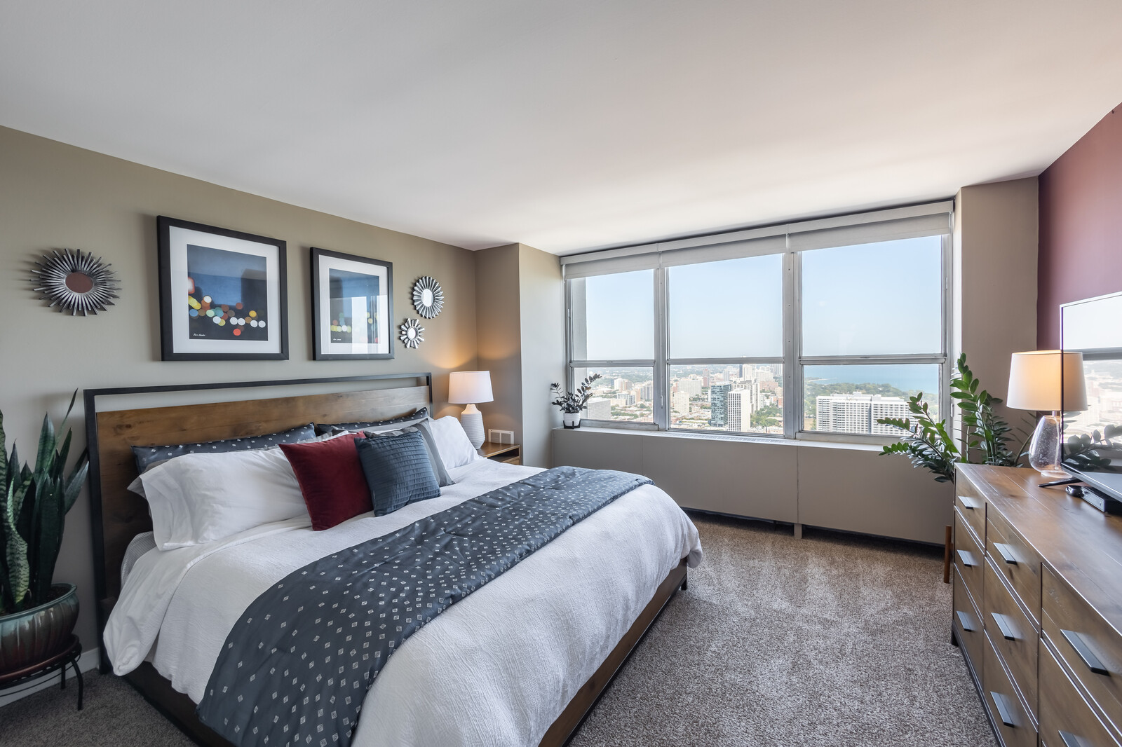 655 West Irving Park Road, Unit 4616 Chicago, IL 60613 - Photo 10 of 25 a bedroom with a large bed and a large window