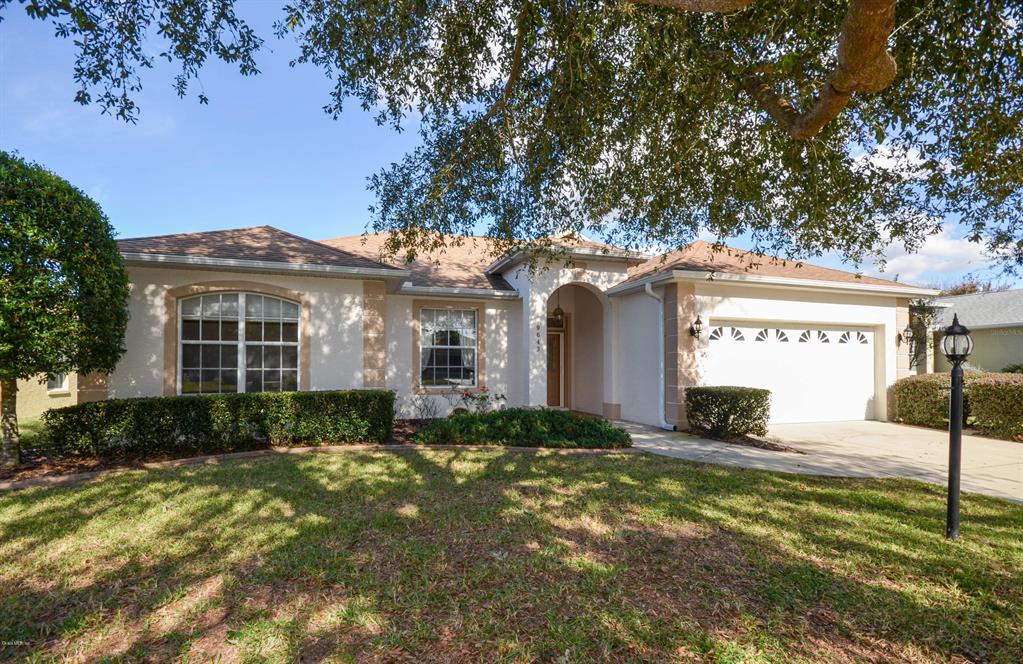 9643 Southwest 92nd Place Road Ocala, FL 34481 - Photo 1 of 1 a view of a house with a yard