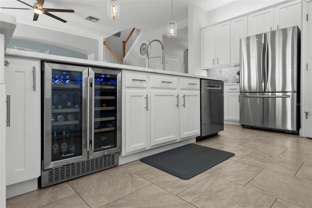 5210 Covesound Way Apollo Beach, FL 33572 - Photo 18 of 82 a kitchen with refrigerator and cabinets