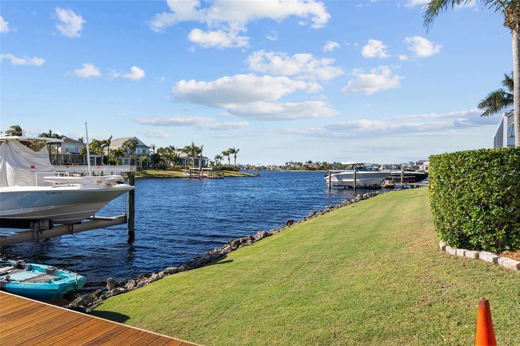 5210 Covesound Way Apollo Beach, FL 33572 - Photo 51 of 82 a view of a swimming pool with an outdoor seating and a garden