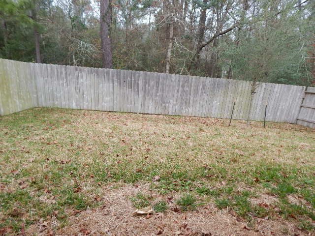 7103 Silverleaf Oak Street Conroe, TX 77304 - Photo 20 of 20 a view of wooden fence