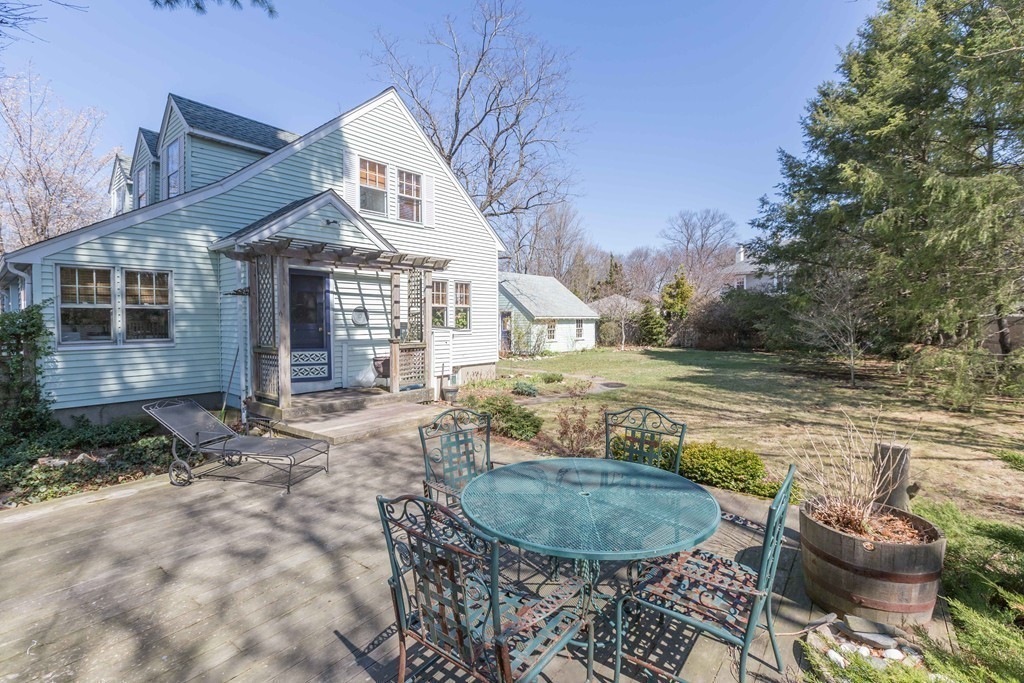 18 Rider Terrace Newton, MA 02466 - Photo 1 of 19 a view of a house with backyard and sitting area