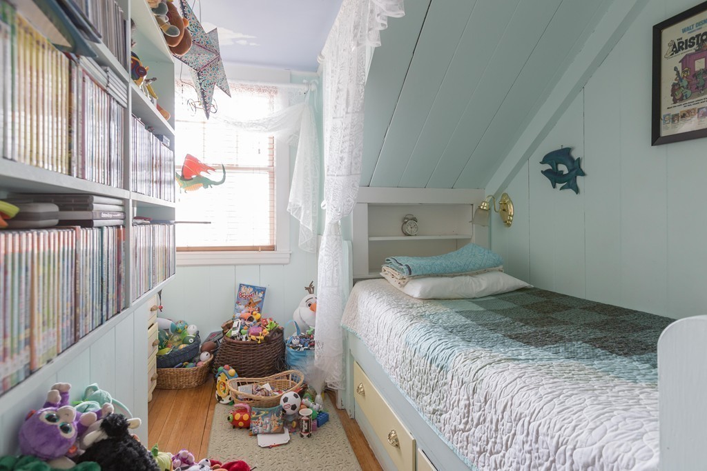 18 Rider Terrace Newton, MA 02466 - Photo 11 of 19 a bedroom with a bed and windows
