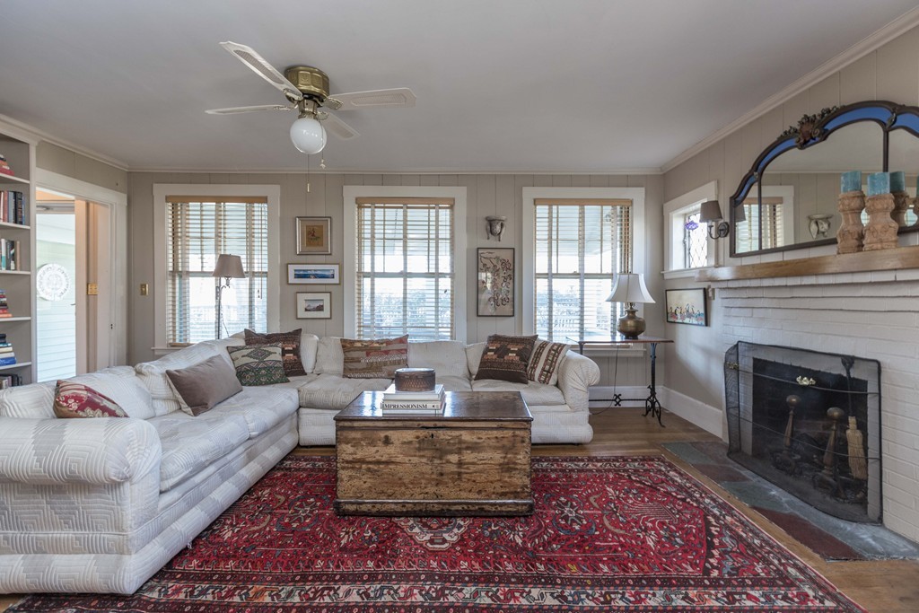 18 Rider Terrace Newton, MA 02466 - Photo 3 of 19 a living room with furniture a fireplace and a large window