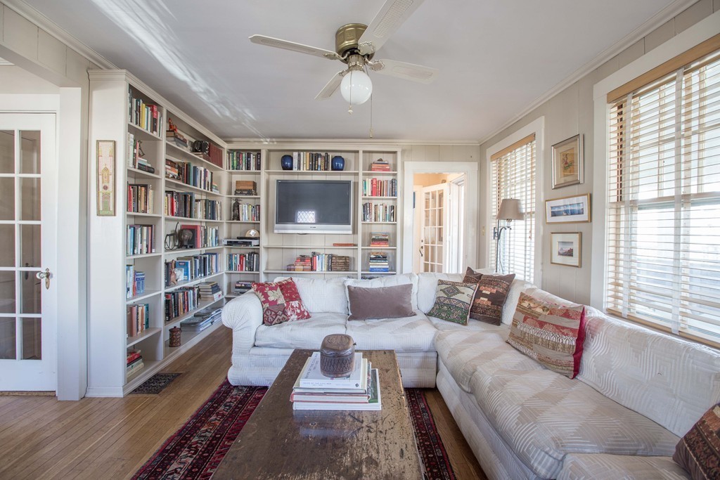 18 Rider Terrace Newton, MA 02466 - Photo 4 of 19 a living room with furniture and a book shelf