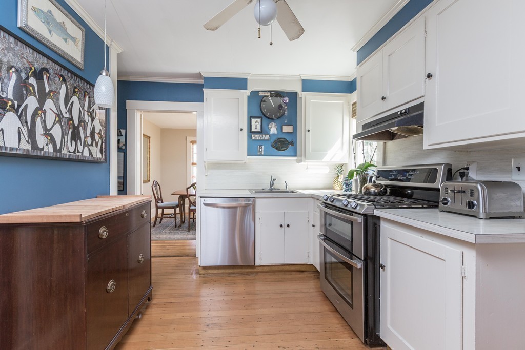 18 Rider Terrace Newton, MA 02466 - Photo 7 of 19 a kitchen with stainless steel appliances granite countertop a sink and a stove