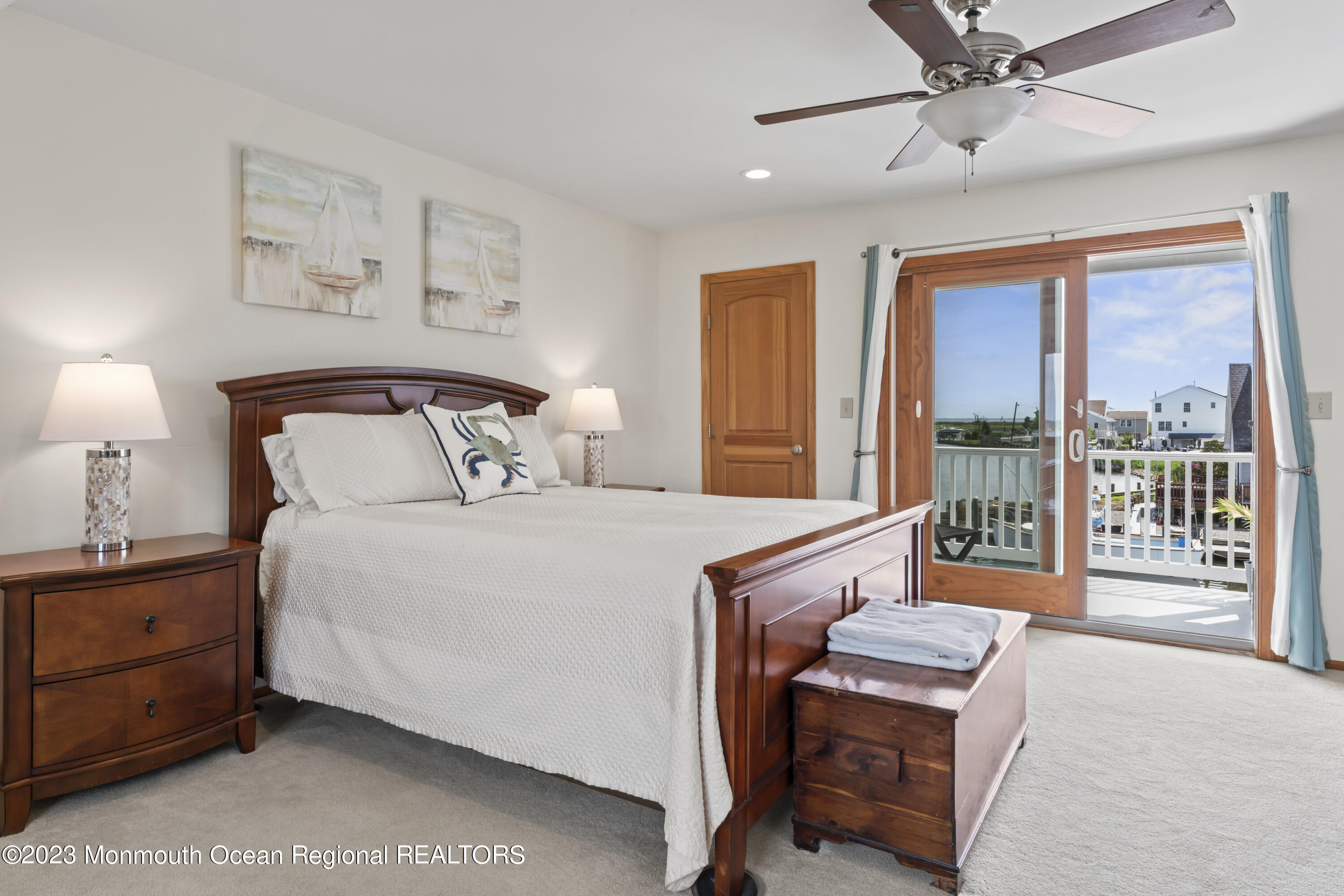 42 Capstan Road Waretown, NJ 08758 - Photo 15 of 57 a bedroom with a bed and a large window