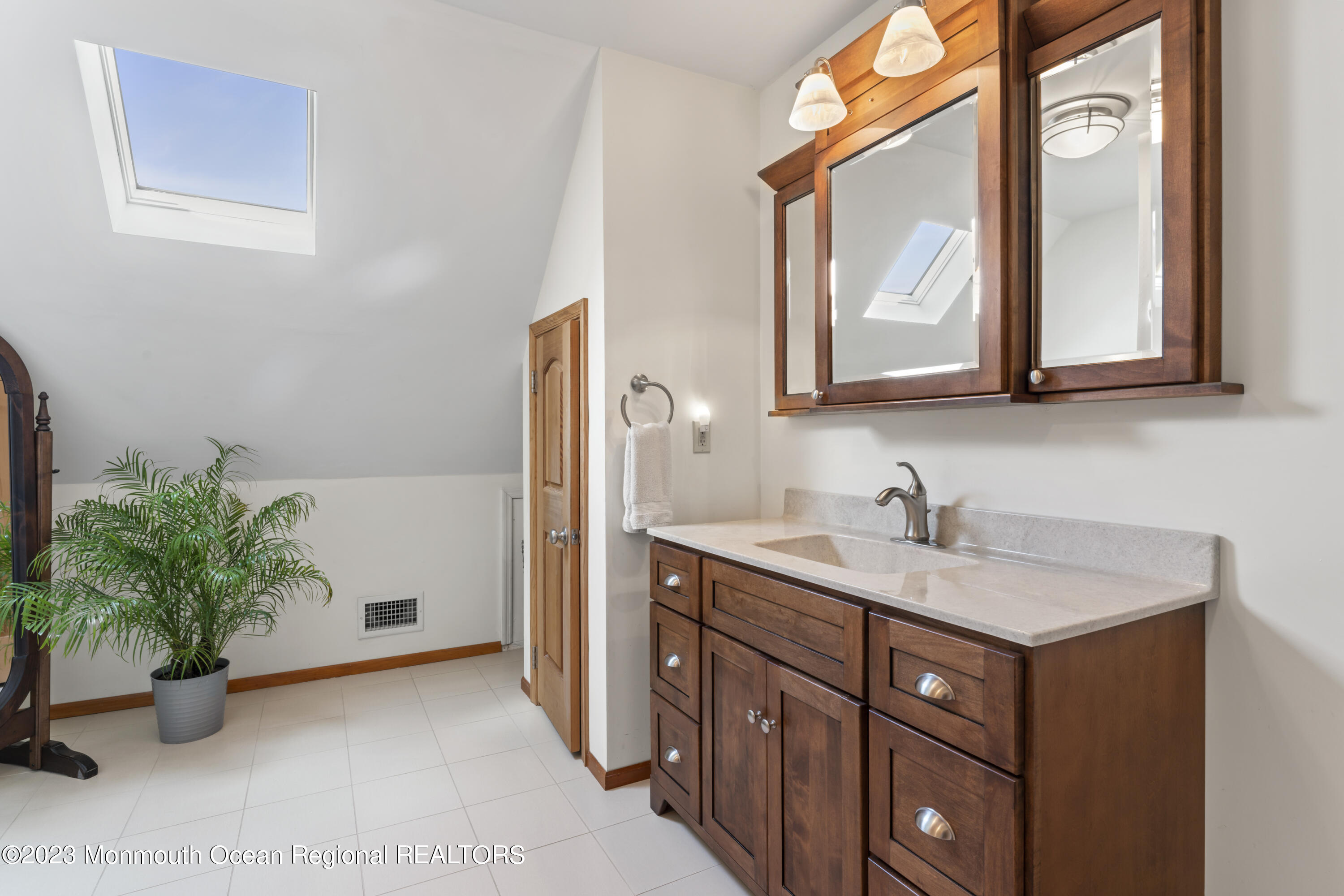 42 Capstan Road Waretown, NJ 08758 - Photo 17 of 57 a bathroom with a sink and a mirror