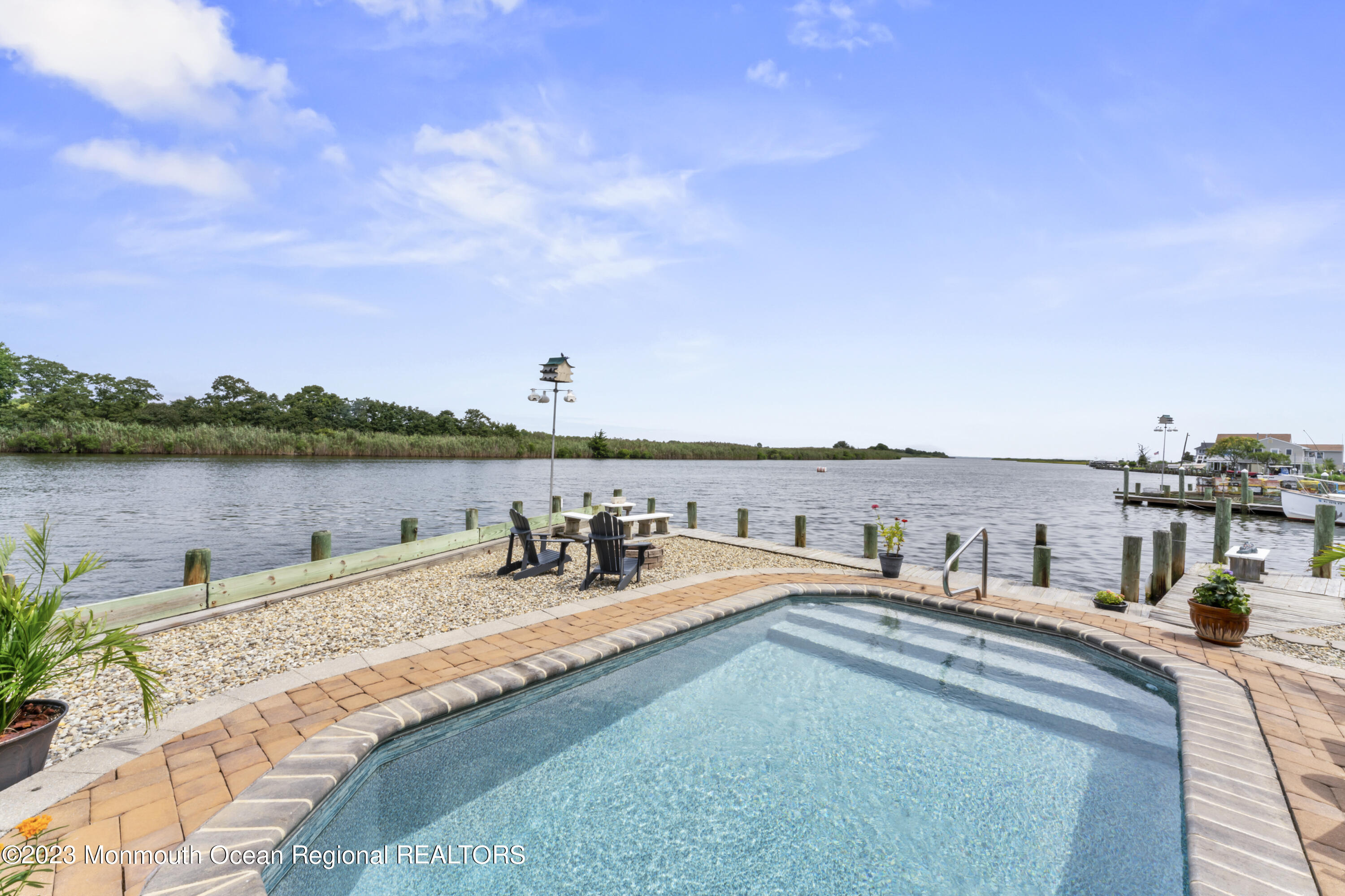 42 Capstan Road Waretown, NJ 08758 - Photo 27 of 57 a view of a lake with outdoor seating