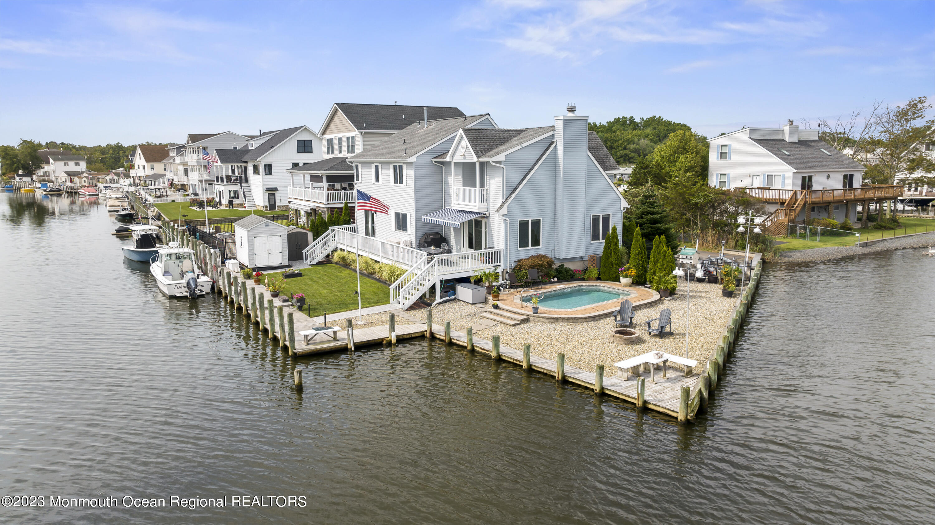 42 Capstan Road Waretown, NJ 08758 - Photo 31 of 57 a view of a lake with a house