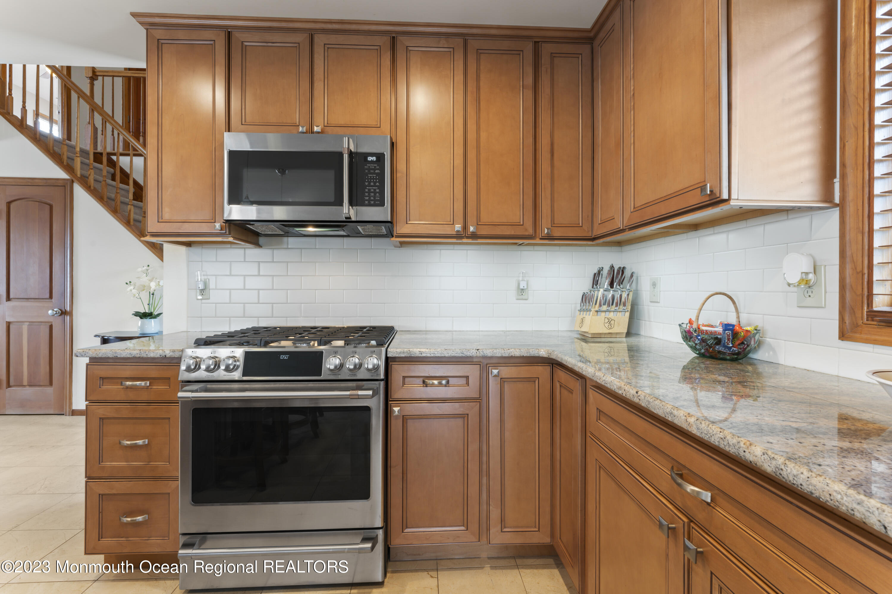 42 Capstan Road Waretown, NJ 08758 - Photo 46 of 57 a kitchen with stainless steel appliances granite countertop a stove microwave and sink