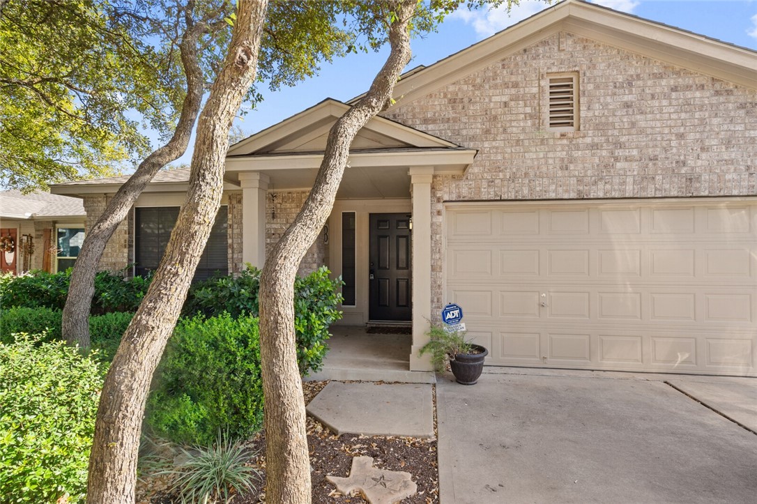3323 Cantera Way Round Rock, TX 78681 - Photo 1 of 1 a front view of a house with garden