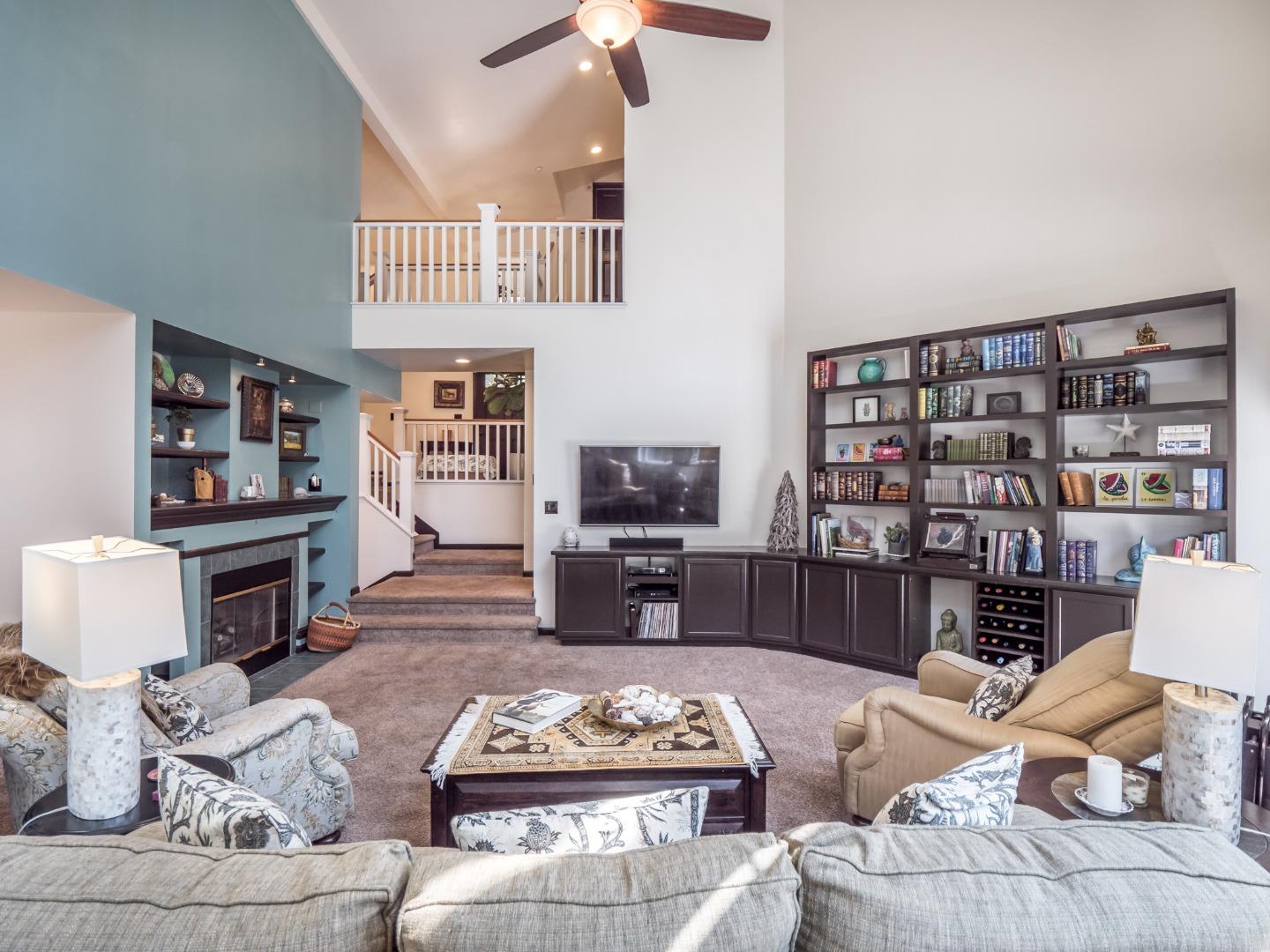 2185 Hames Road Aptos, CA 95003 - Photo 18 of 88 a living room with furniture a rug and a bookshelf
