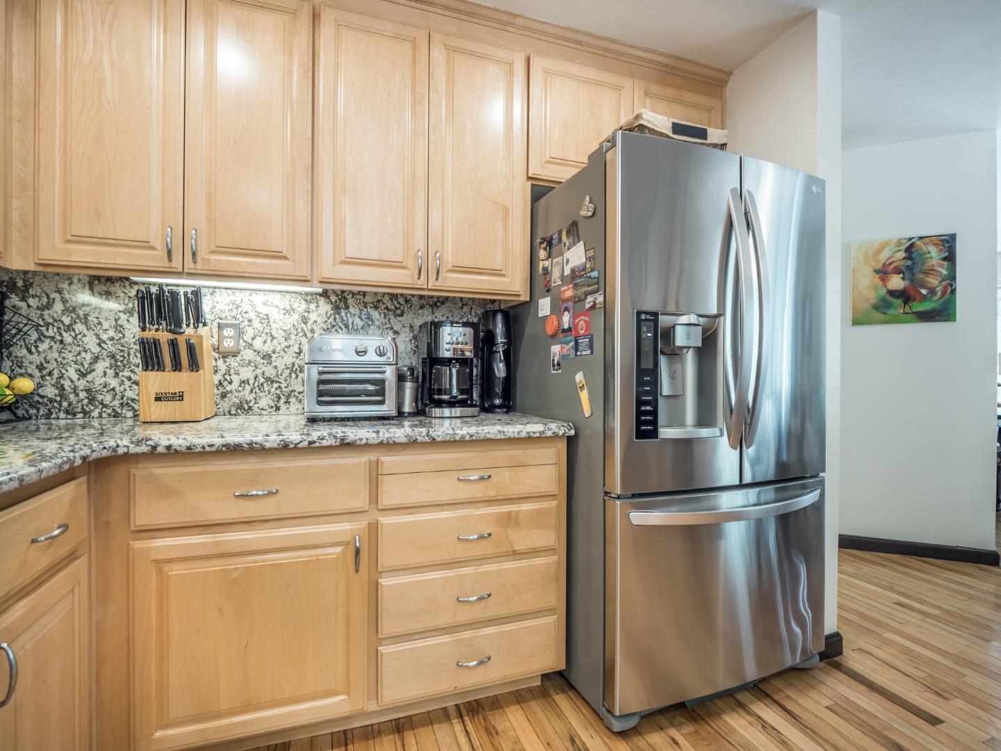 2185 Hames Road Aptos, CA 95003 - Photo 32 of 88 a kitchen with appliances a refrigerator and cabinets