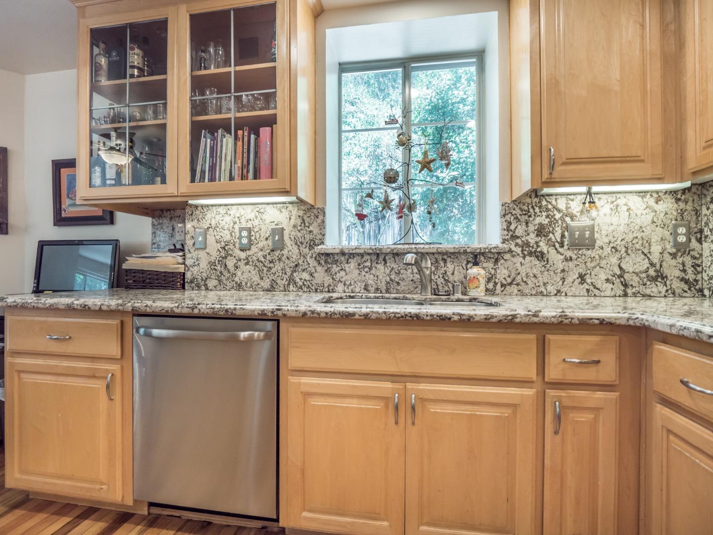 2185 Hames Road Aptos, CA 95003 - Photo 35 of 88 a kitchen with granite countertop white cabinets window and sink
