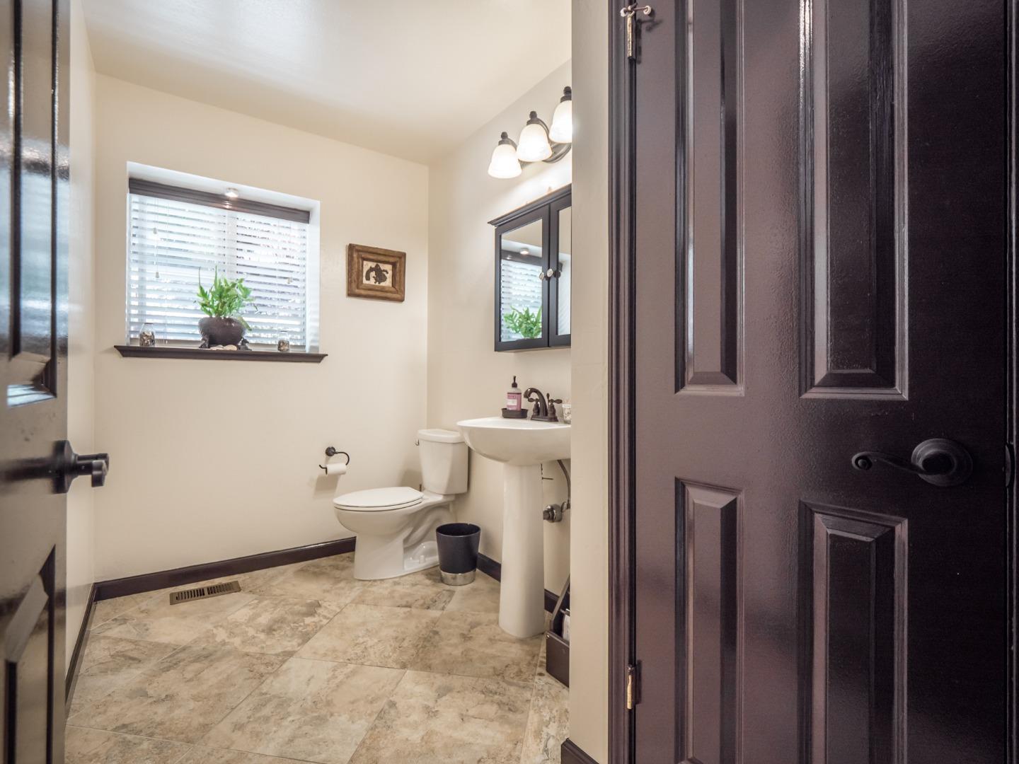 2185 Hames Road Aptos, CA 95003 - Photo 37 of 88 a bathroom with a toilet a sink and a mirror