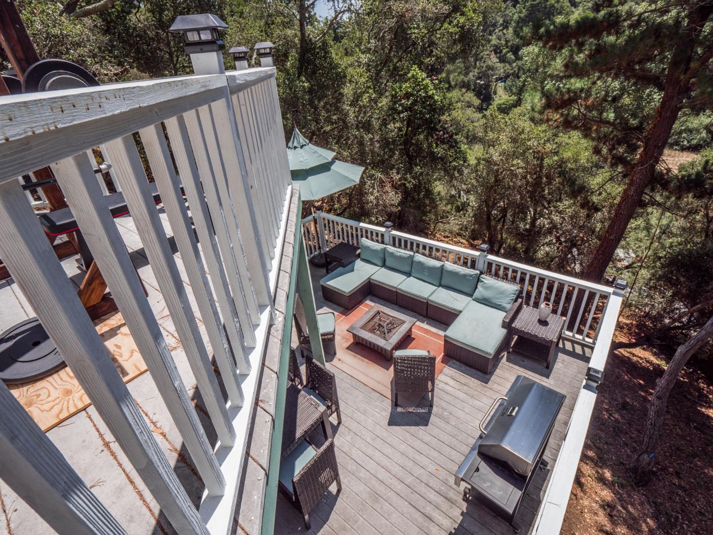 2185 Hames Road Aptos, CA 95003 - Photo 66 of 88 a balcony with wooden floor stairs and outdoor seating