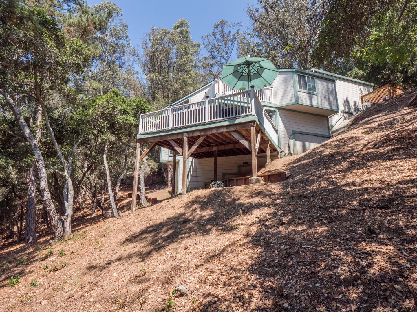 2185 Hames Road Aptos, CA 95003 - Photo 70 of 88 a view of a house with a large tree and wooden fence