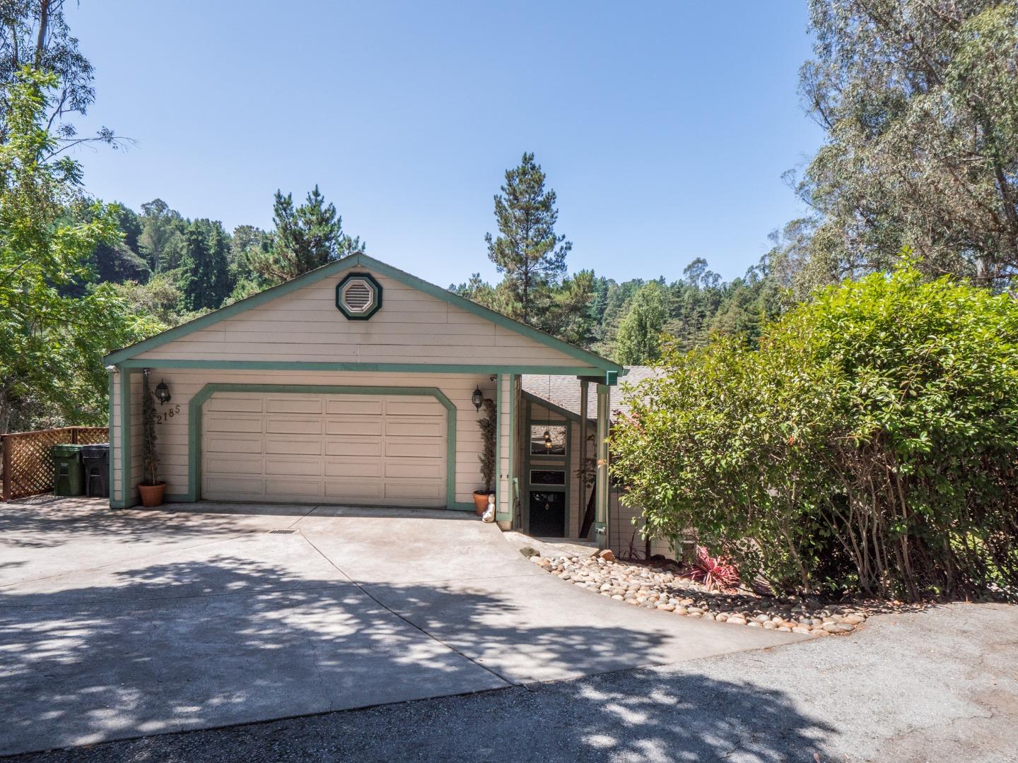 2185 Hames Road Aptos, CA 95003 - Photo 76 of 88 a front view of a house with a yard and garage