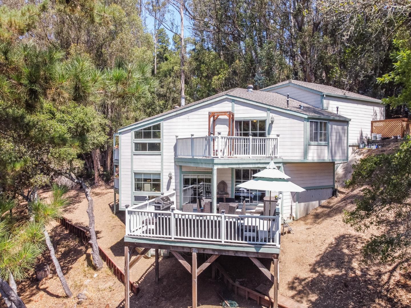 2185 Hames Road Aptos, CA 95003 - Photo 80 of 88 a front view of a house with a chairs and table in a patio
