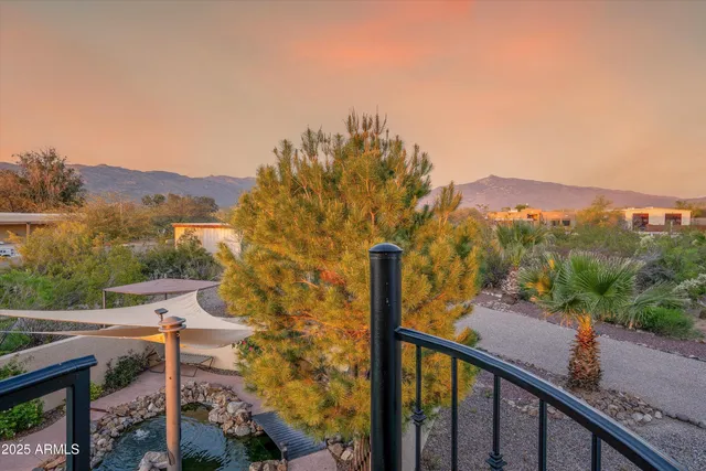 a spacious bedroom with a bed and a chandelier