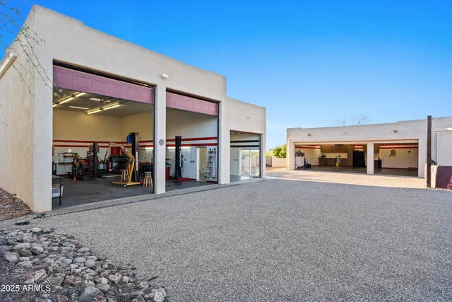 a view of a patio with table and chairs potted plants with wooden fence