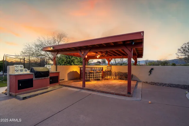 a bedroom with a bed and a fireplace