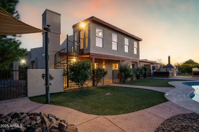 a view of a street with a bench and trees