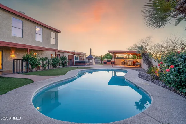 a view of a swimming pool with an outdoor seating