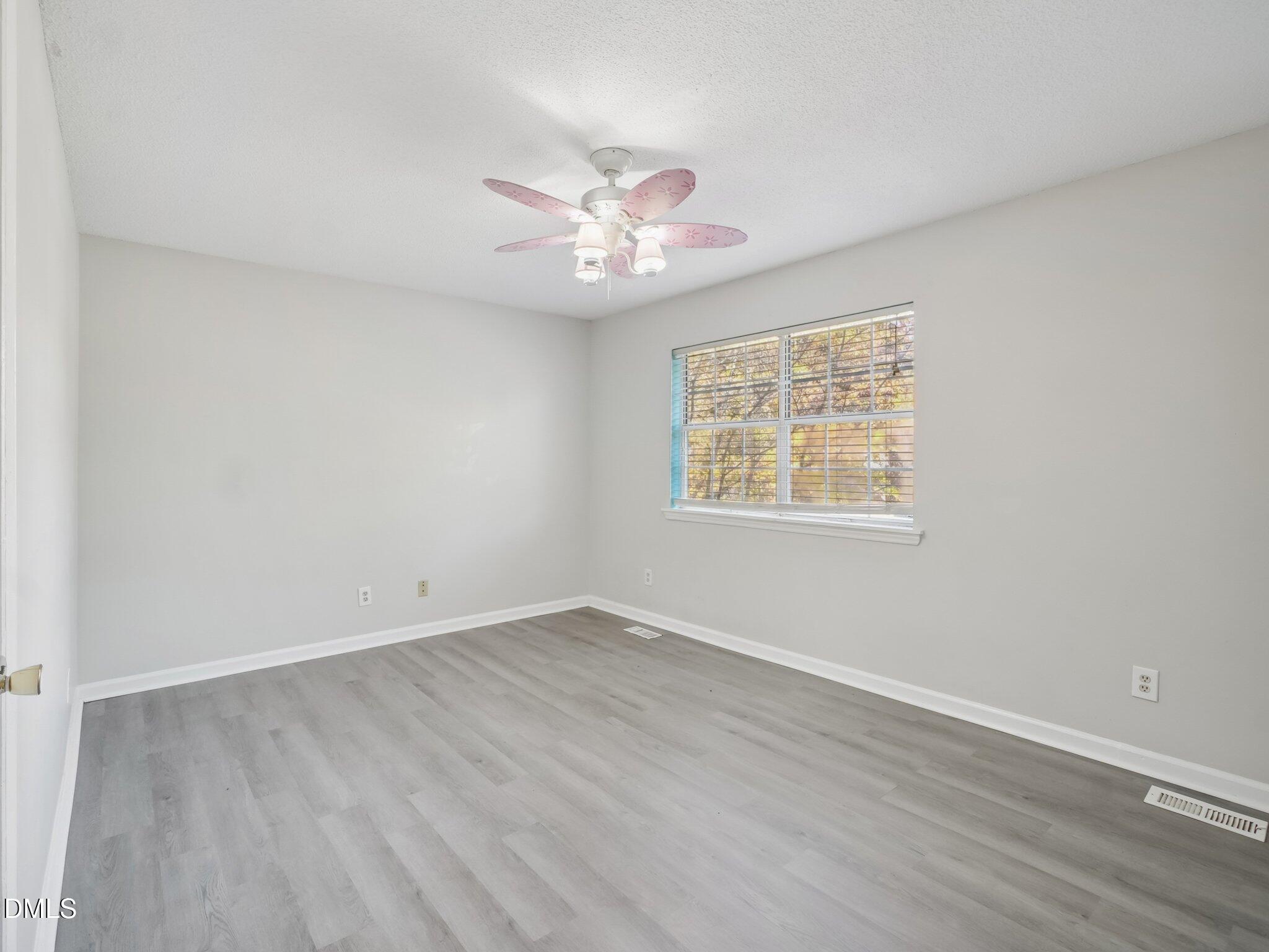 2146 Charles Street, Unit 37 Durham, NC 27707 - Photo 18 of 24 wooden floor in an empty room with a window