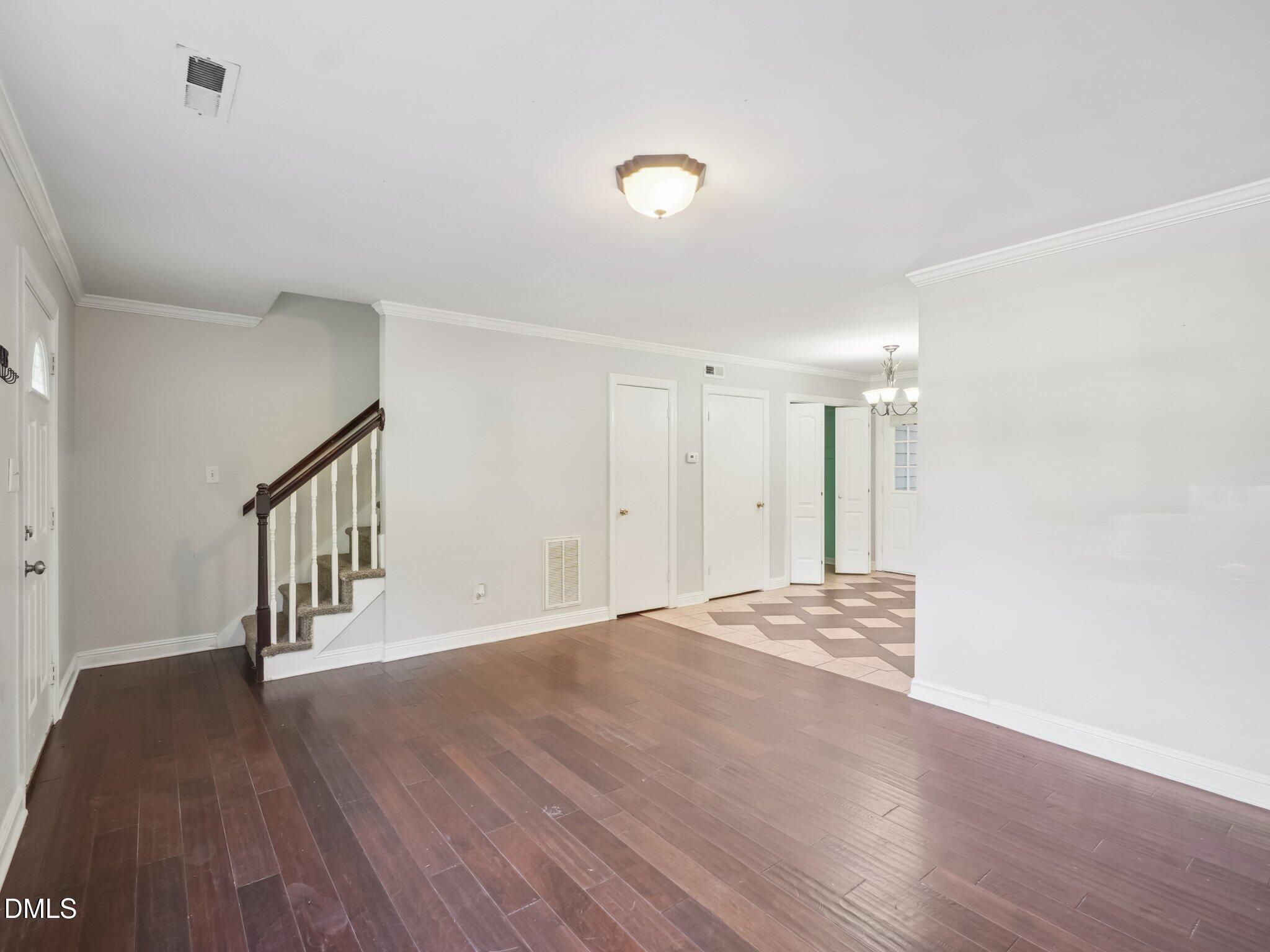 2146 Charles Street, Unit 37 Durham, NC 27707 - Photo 7 of 24 a view of an empty room with wooden floor and stairs