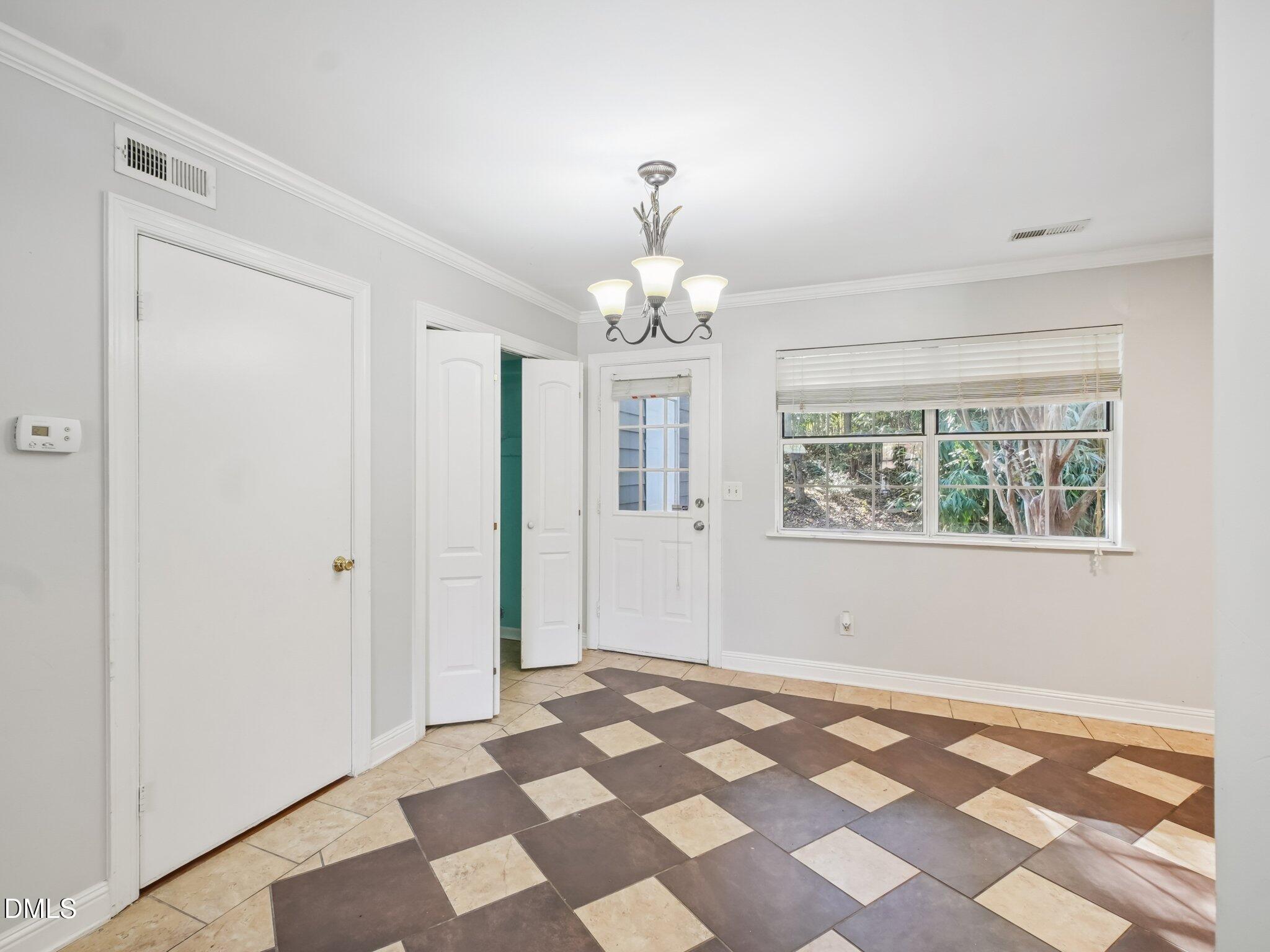 2146 Charles Street, Unit 37 Durham, NC 27707 - Photo 8 of 24 a view of a chandelier in a room