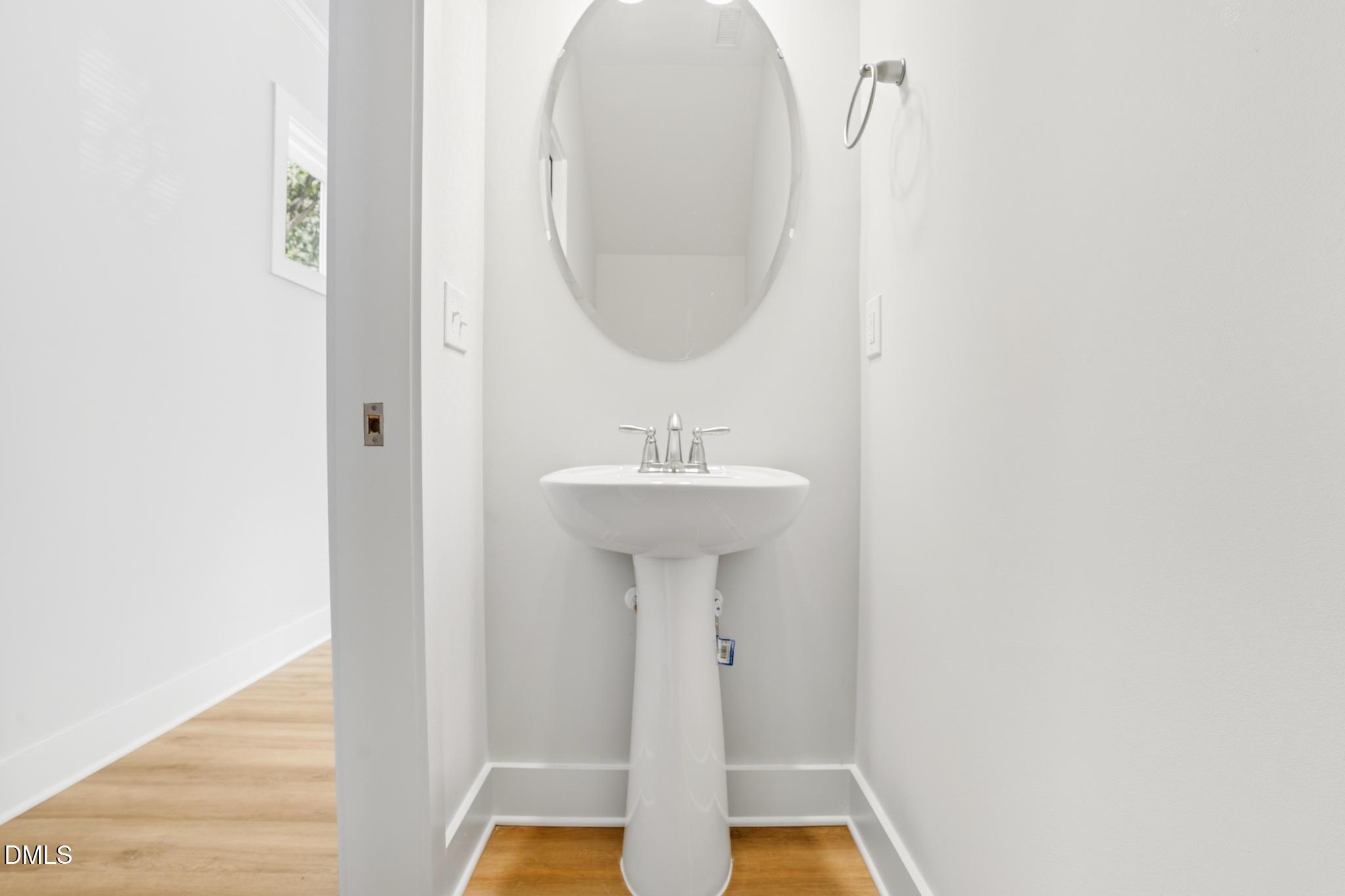 551 Homeland Avenue Durham, NC 27707 - Photo 11 of 32 a bathroom with a sink and a mirror