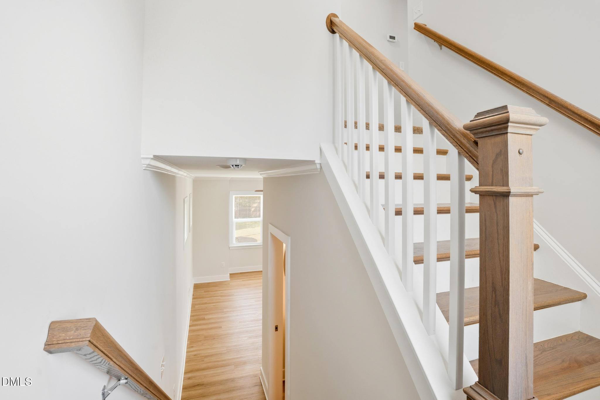 551 Homeland Avenue Durham, NC 27707 - Photo 12 of 32 a view of staircase with wooden floor and white walls