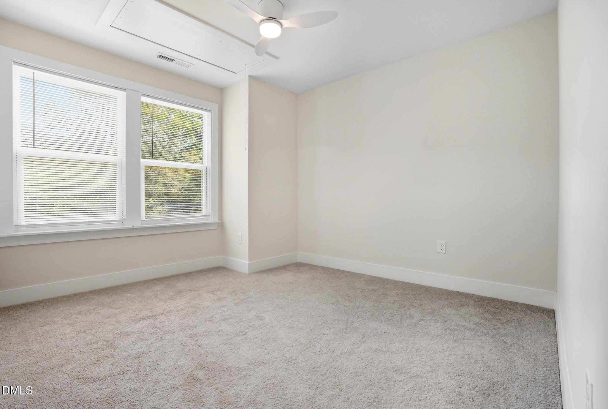 551 Homeland Avenue Durham, NC 27707 - Photo 19 of 32 an empty room with a window