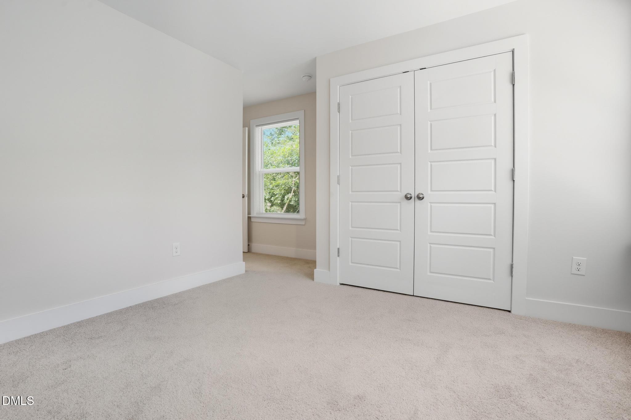 551 Homeland Avenue Durham, NC 27707 - Photo 20 of 32 an empty room with closet area
