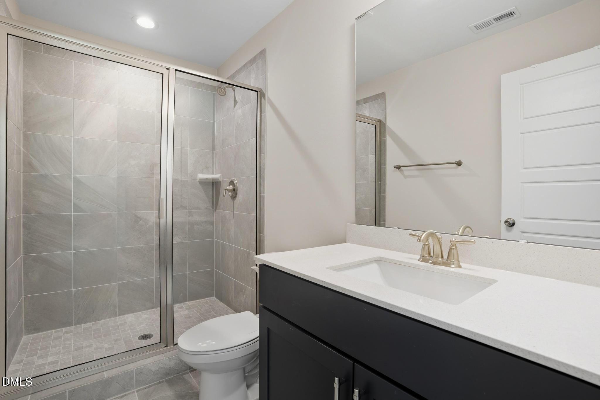 551 Homeland Avenue Durham, NC 27707 - Photo 21 of 32 a bathroom with a sink toilet and shower