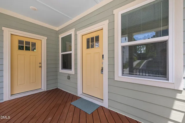 a view of a house with wooden floor and a window