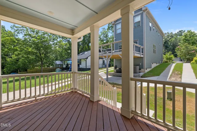 a view of balcony with wooden floor