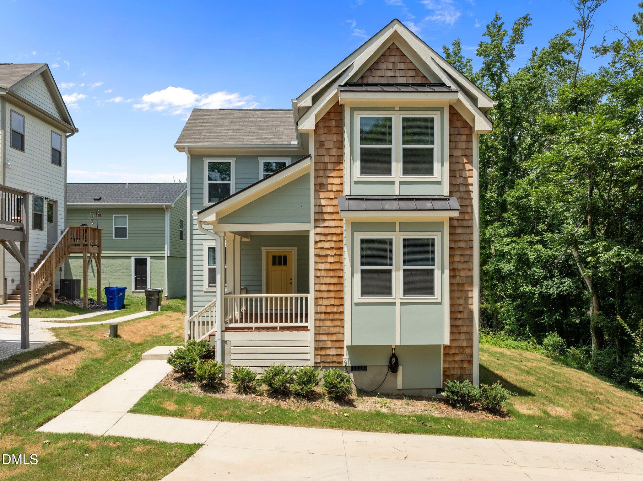 551 Homeland Avenue Durham, NC 27707 - Photo 31 of 32 a front view of a house with a yard