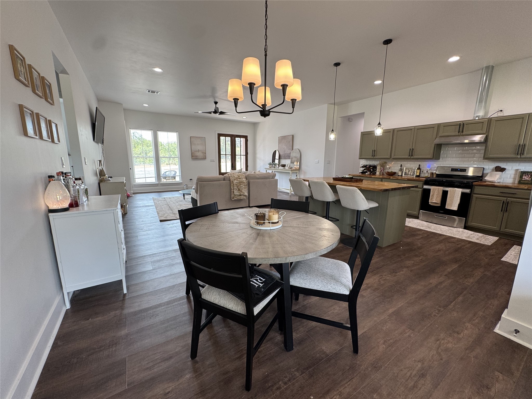 1353 Red Town Road, Unit B Elgin, TX 78621 - Photo 5 of 26 Rich hardwood flooring anchors this expansive open concept kitchen and casual dining area.