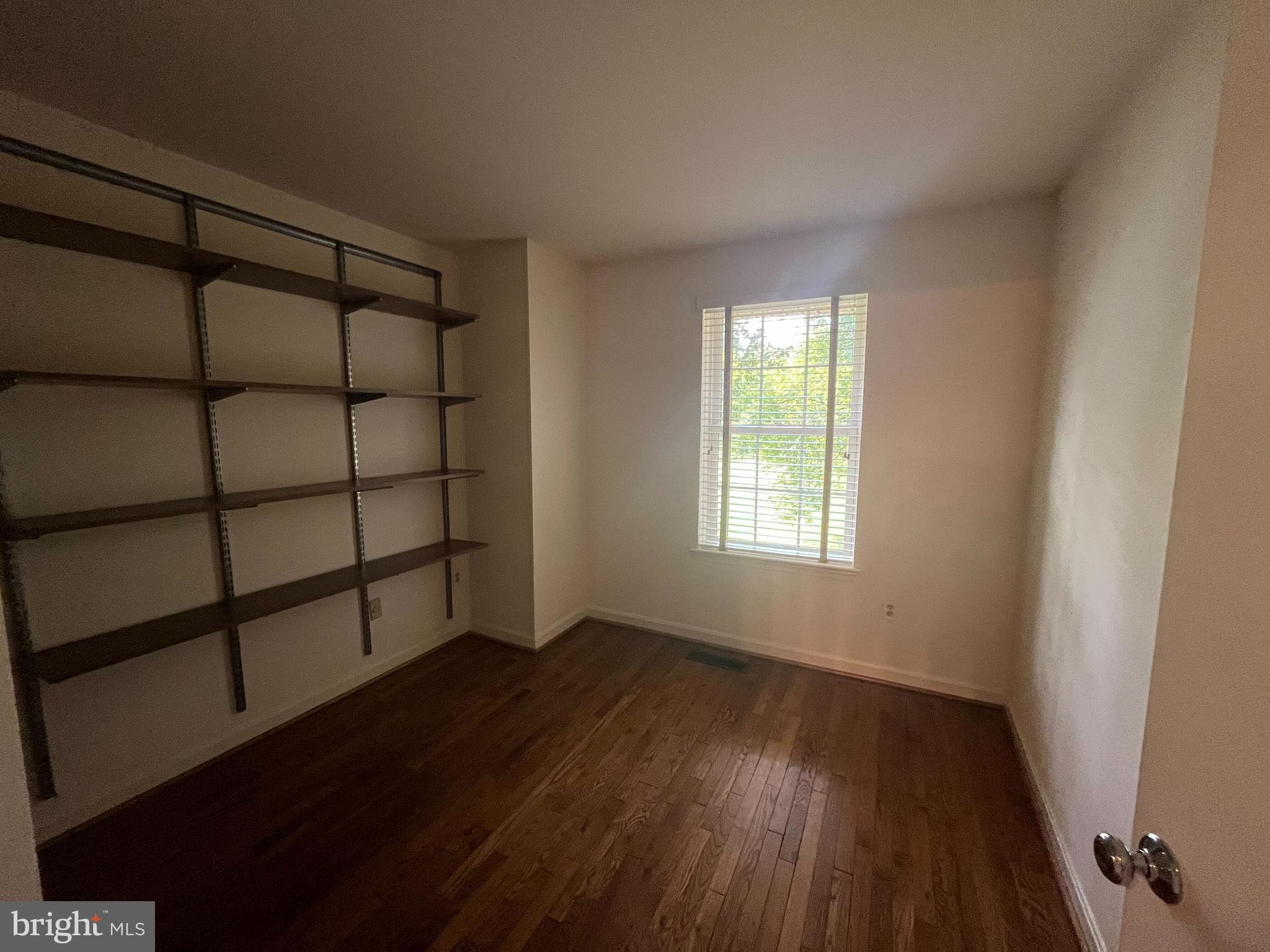 2080 Golf Course Drive Reston, VA 20191 - Photo 11 of 17 a view of a room with wooden floor and windows