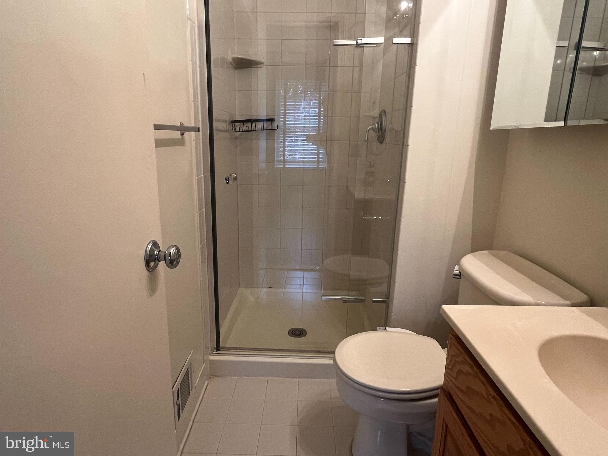 2080 Golf Course Drive Reston, VA 20191 - Photo 10 of 17 a bathroom with a sink toilet and shower