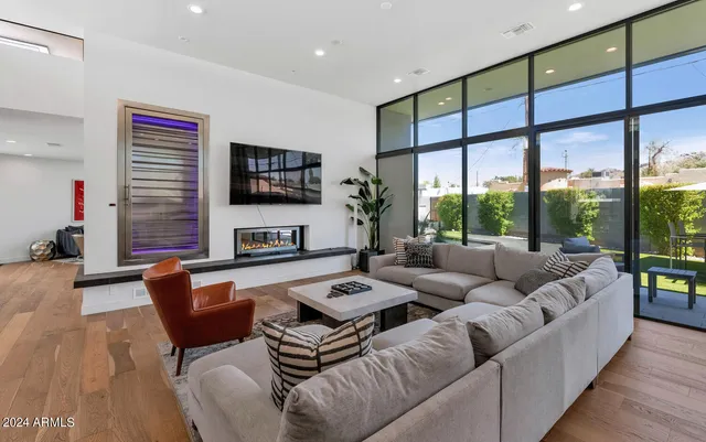 a living room with furniture and a large window