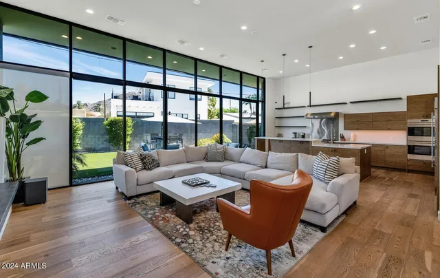a kitchen with stainless steel appliances kitchen island granite countertop a sink and a stove