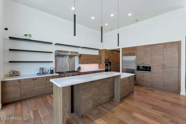 wooden floor in a hall with a window and wooden floor